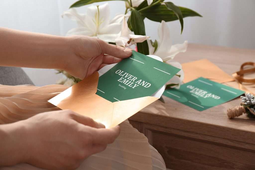 Person opening a wedding invitation