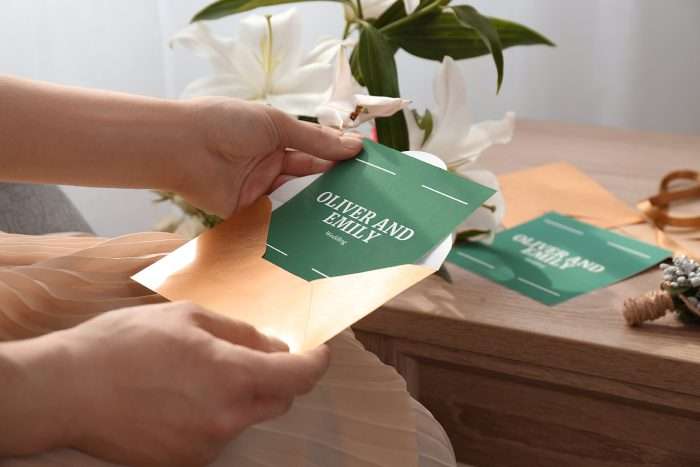 Person opening a wedding invitation